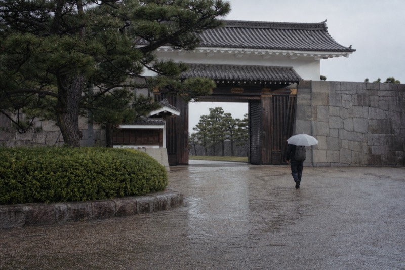 The Otemon gate approach to Osaka Castle with stone walls flanking the path across the moat