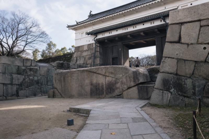 The Sakuramon gate and massive stone walls rising above the inner moat at Osaka Castle